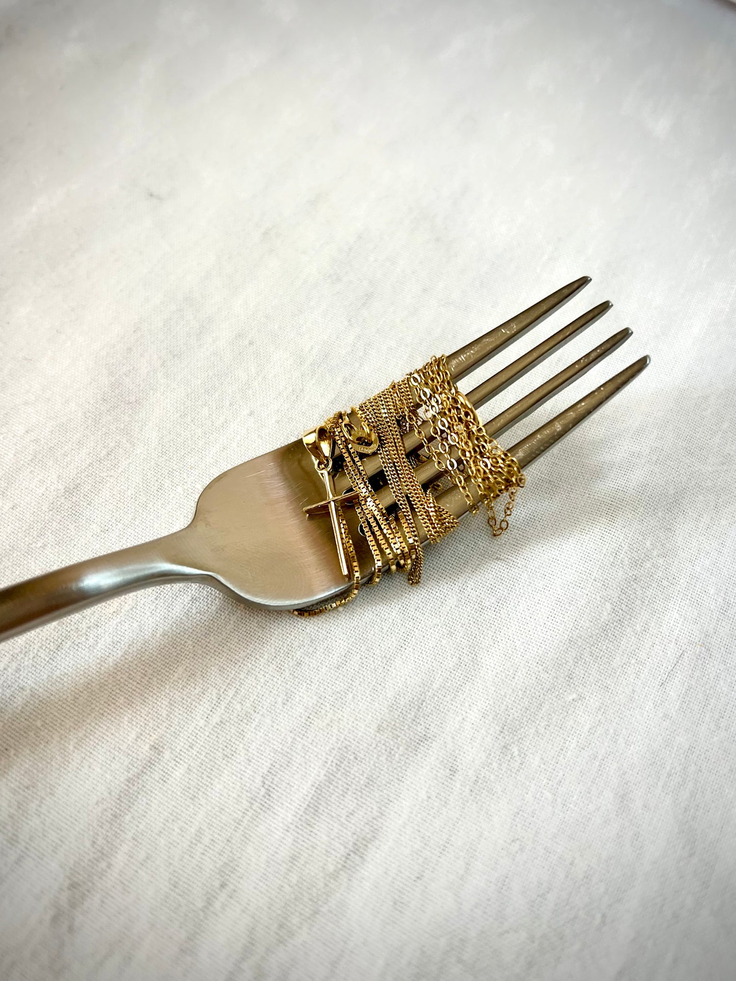 Facet cut cross 14K gold